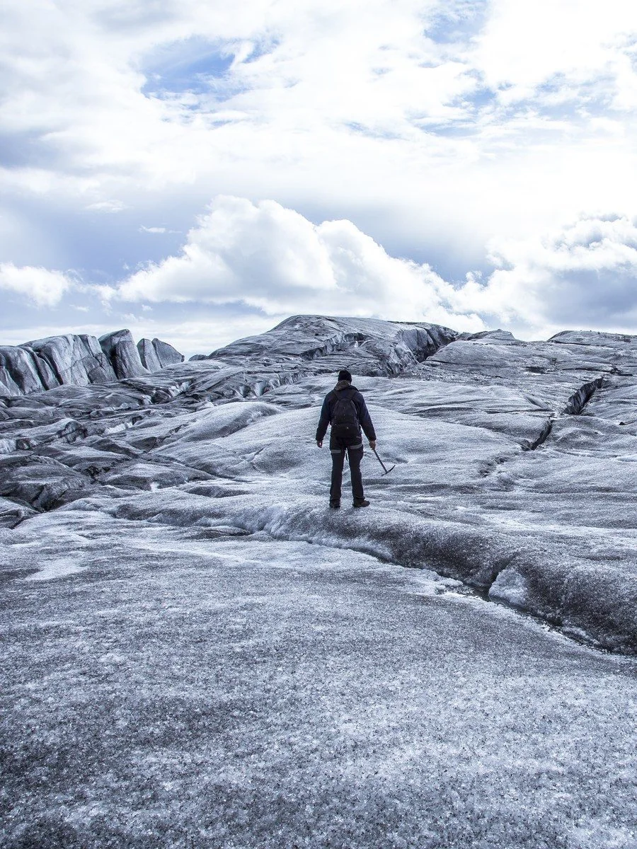 Researcher crossing a glacier during Arctic fieldwork